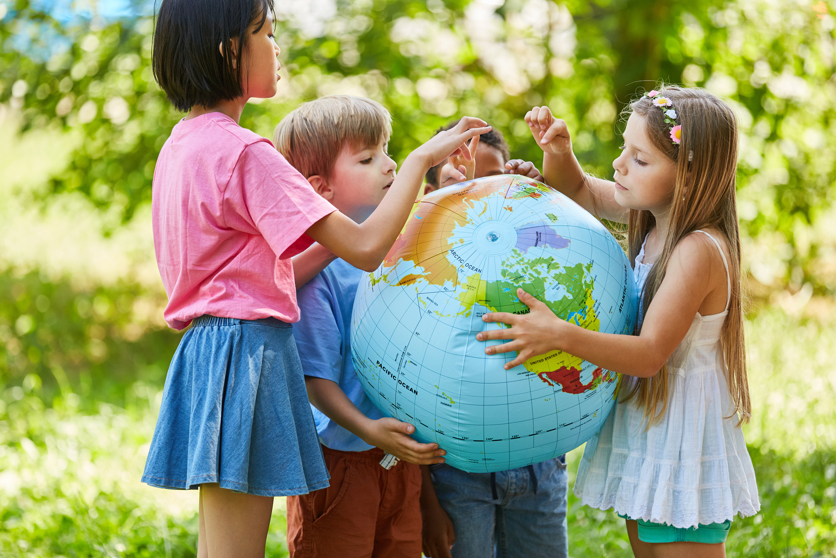 Children Together Holding a Globe